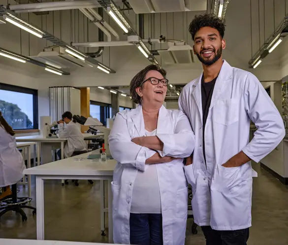 Photo of two researchers in a lab setting.