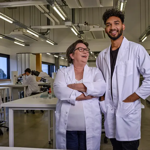 Photo of two researchers in a lab setting.