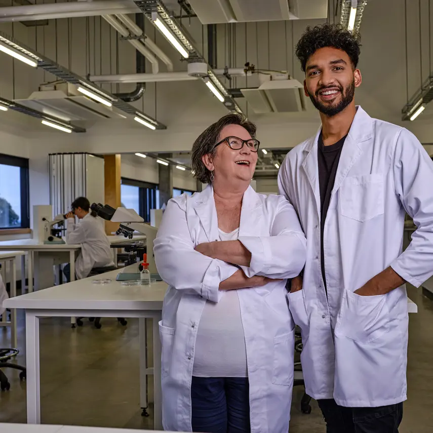 Photo of two researchers in a lab setting.