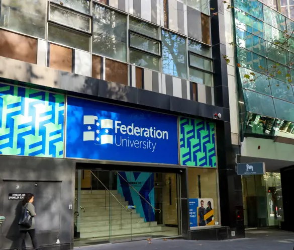 Outside photo of Federation University Melbourne City Campus with people passing on the street.
