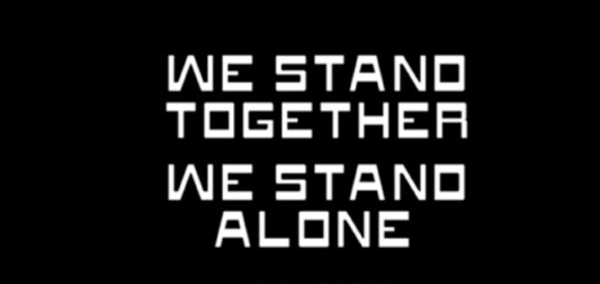 Text: We stand together, we stand alone